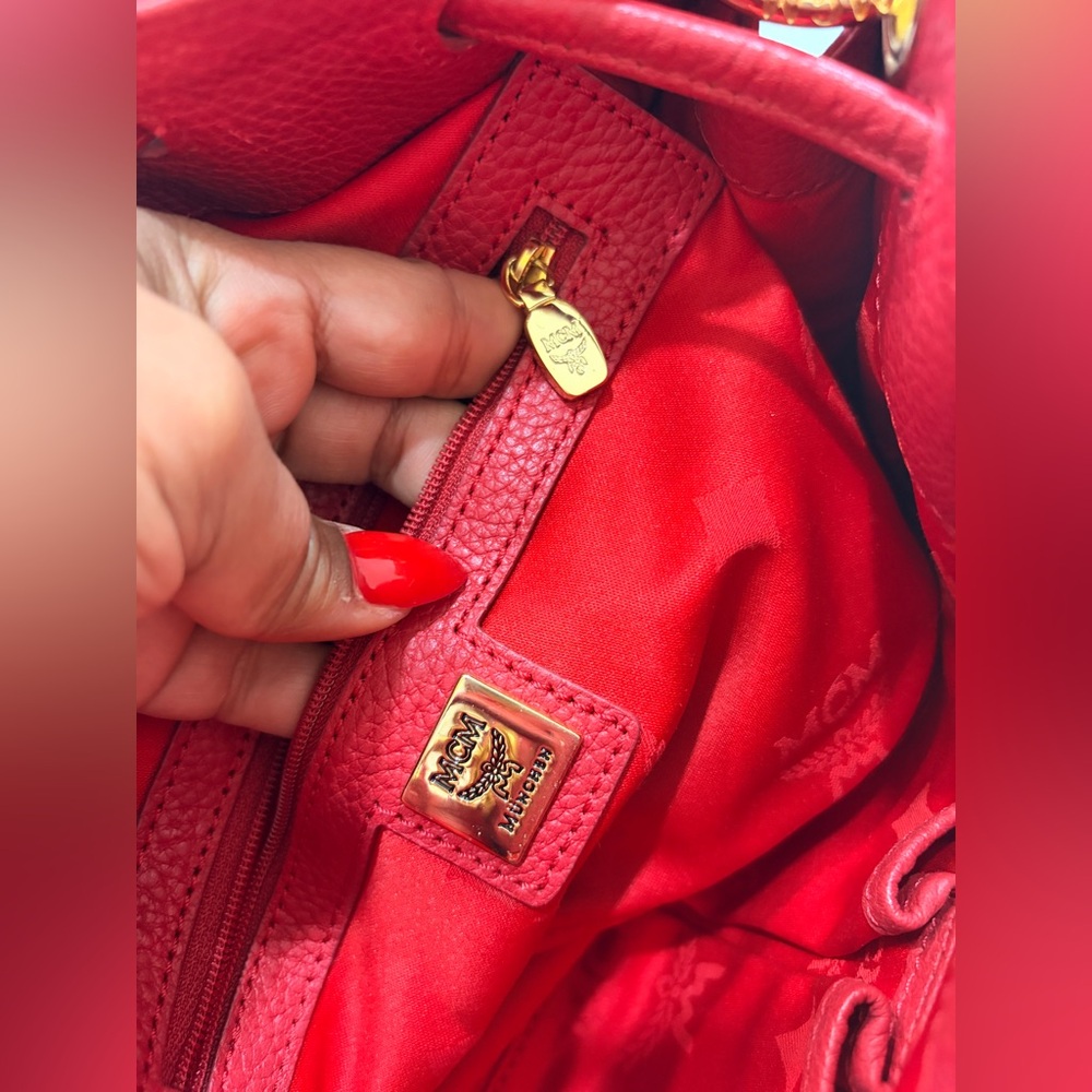 MCM Red Leather Bucket Bag
Crossbody Drawstring Gold Hardware - Picture 15 of 17